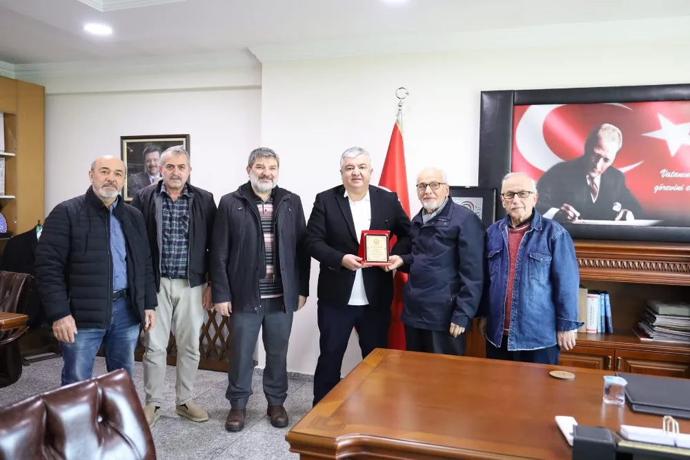 ÜNHADER’den Başkan Uslu’ya Teşekkür Plaketi